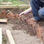 Laying brick path edge